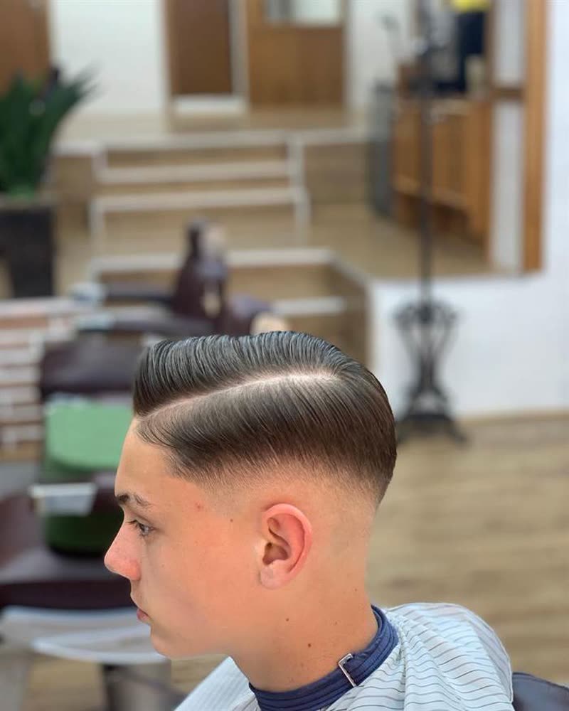 Side part comb over with a fade